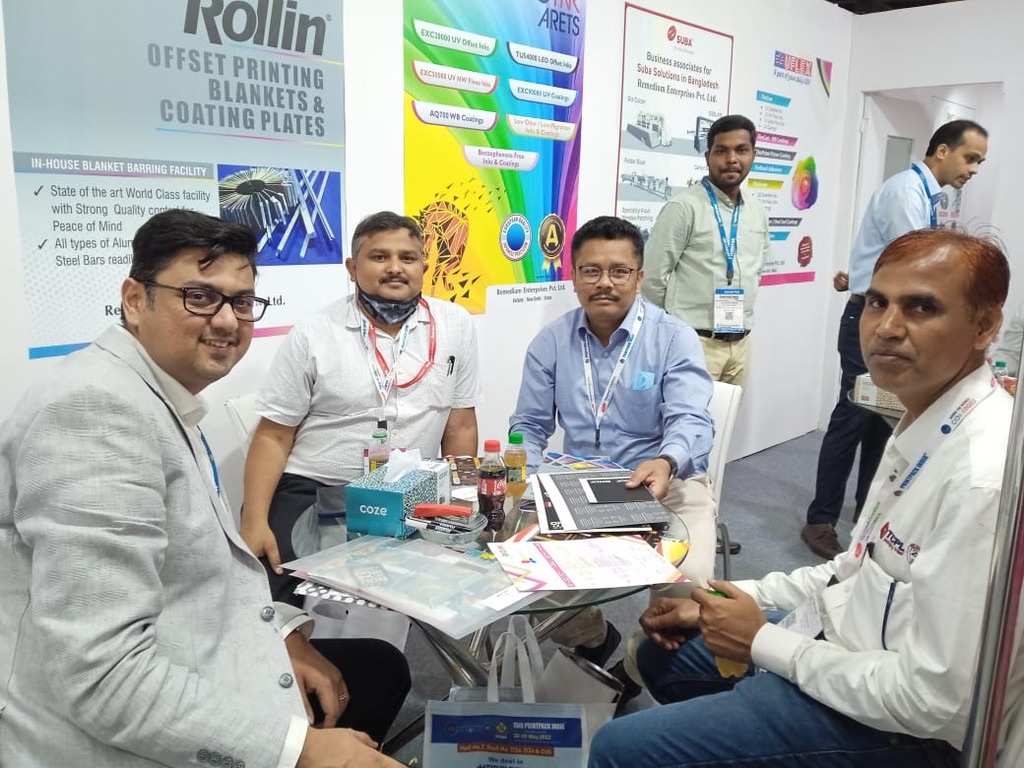 Printing industry visitors in discussion at the Remedium stand, Print Pack India 2022