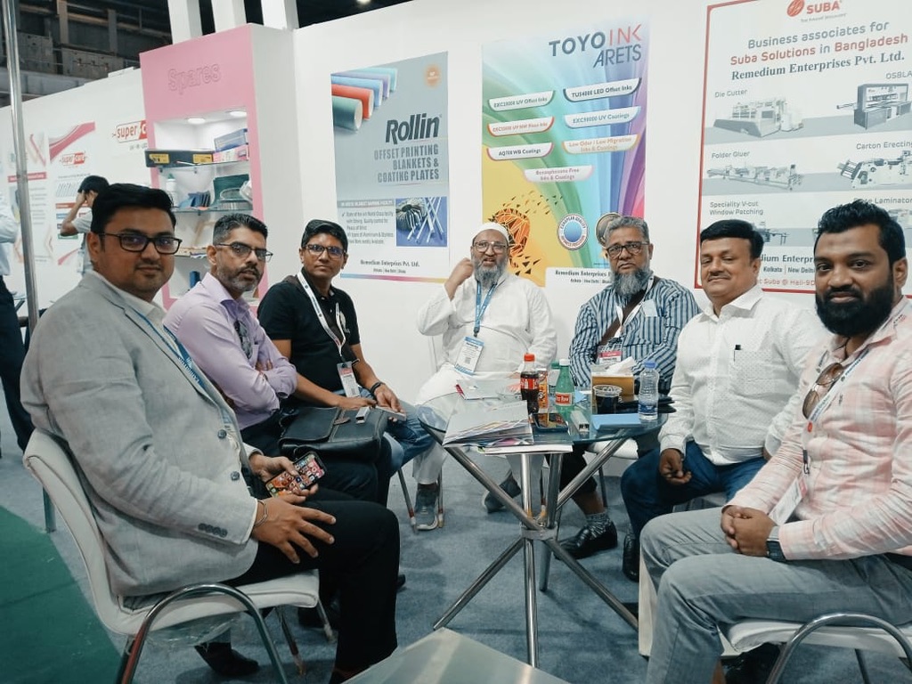 Visitors meeting at Remedium stand at Print Pack India 2022 with Rollin blanket and Toyo Ink displays
